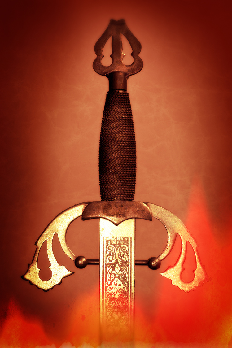 Hilt of a medieval sword on fire